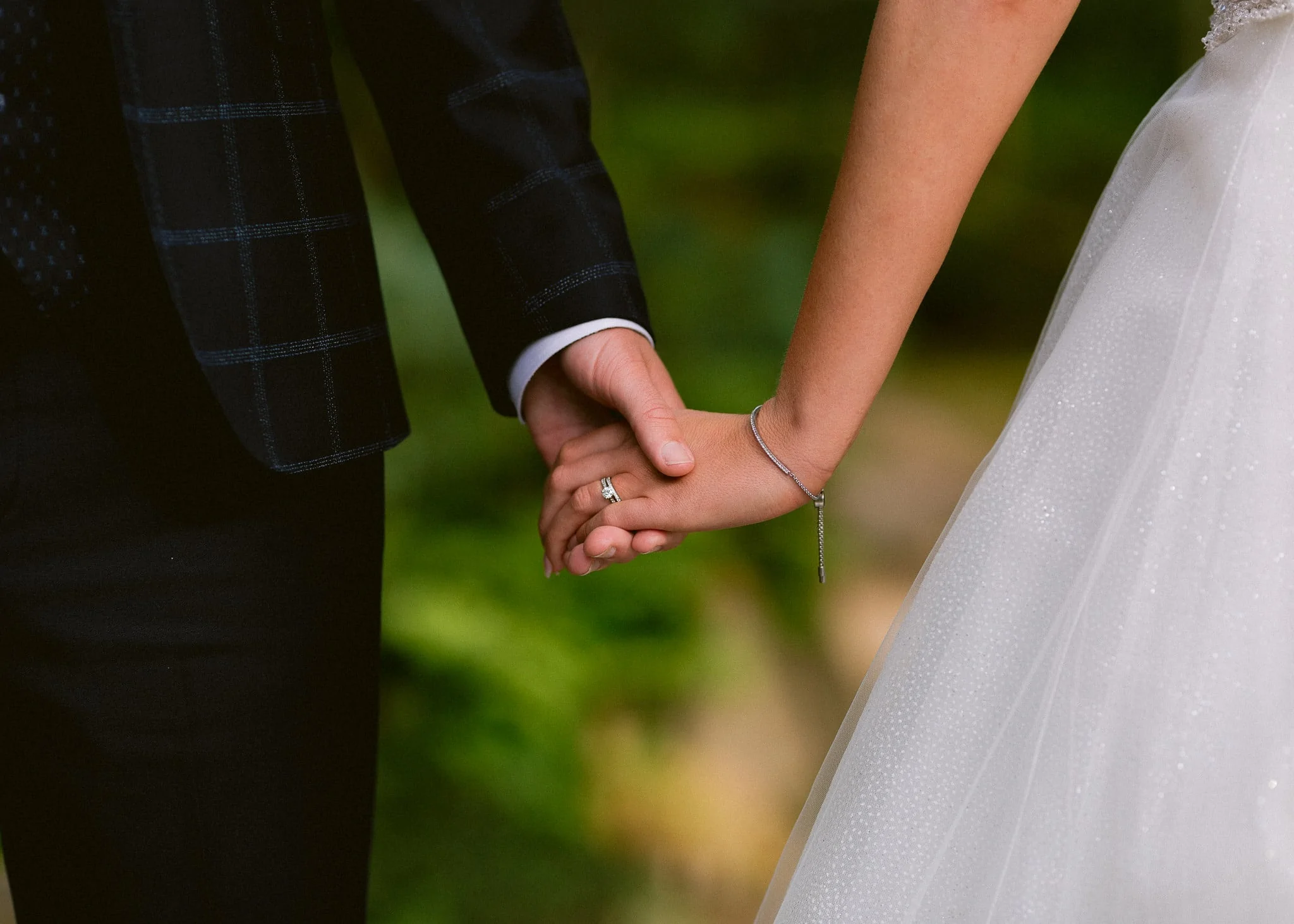 Holding-hands-bride-and-groom